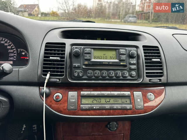 Черный Тойота Камри, объемом двигателя 2.4 л и пробегом 553 тыс. км за 5100 $, фото 8 на Automoto.ua