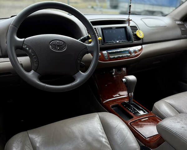 Чорний Тойота Камрі, об'ємом двигуна 3 л та пробігом 203 тис. км за 3999 $, фото 13 на Automoto.ua