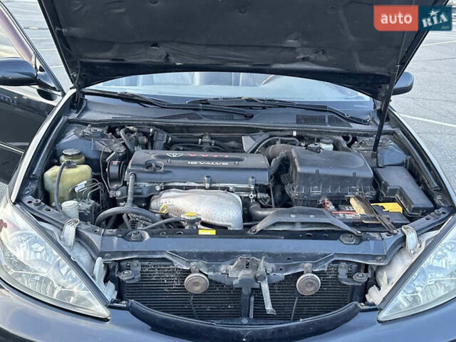 Черный Тойота Камри, объемом двигателя 2.4 л и пробегом 315 тыс. км за 5800 $, фото 16 на Automoto.ua