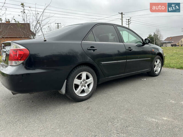 Черный Тойота Камри, объемом двигателя 2.4 л и пробегом 553 тыс. км за 5100 $, фото 4 на Automoto.ua