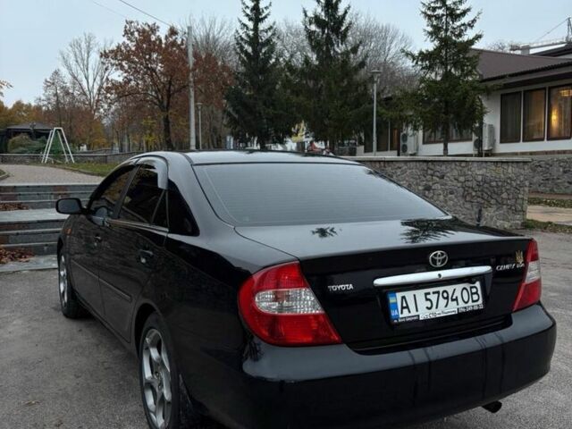 Черный Тойота Камри, объемом двигателя 2.4 л и пробегом 570 тыс. км за 6199 $, фото 2 на Automoto.ua