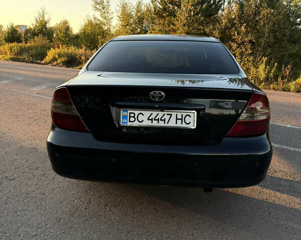 Черный Тойота Камри, объемом двигателя 3 л и пробегом 300 тыс. км за 6000 $, фото 3 на Automoto.ua