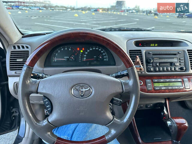 Черный Тойота Камри, объемом двигателя 2.4 л и пробегом 309 тыс. км за 6699 $, фото 13 на Automoto.ua