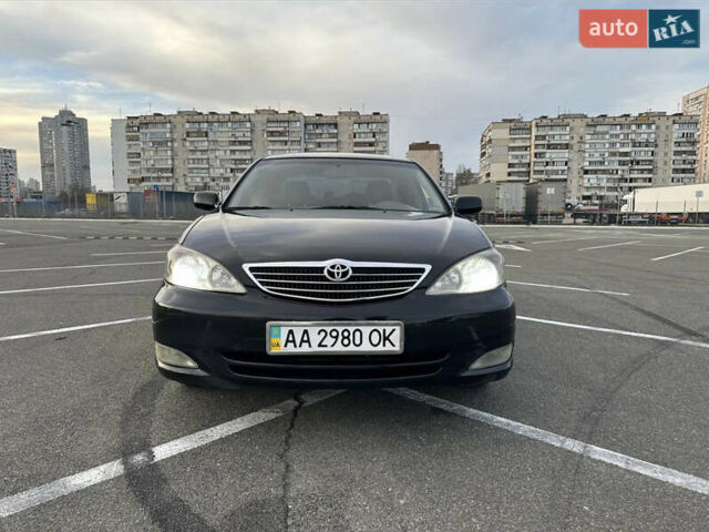 Черный Тойота Камри, объемом двигателя 2.4 л и пробегом 315 тыс. км за 5800 $, фото 1 на Automoto.ua