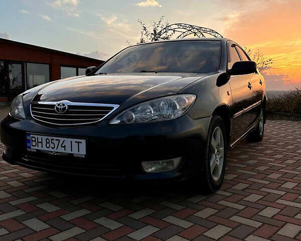 Черный Тойота Камри, объемом двигателя 3 л и пробегом 285 тыс. км за 6500 $, фото 1 на Automoto.ua