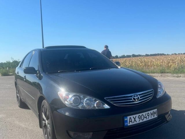 Чорний Тойота Камрі, об'ємом двигуна 2.4 л та пробігом 240 тис. км за 6200 $, фото 10 на Automoto.ua