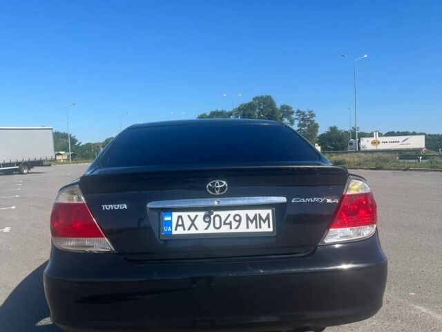 Чорний Тойота Камрі, об'ємом двигуна 2.4 л та пробігом 240 тис. км за 6200 $, фото 12 на Automoto.ua