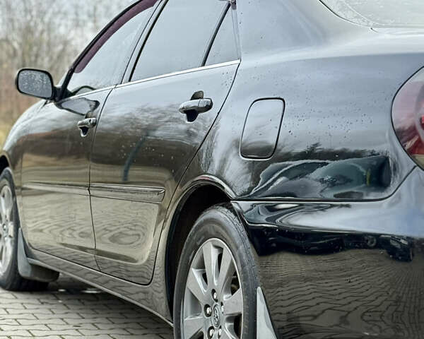 Чорний Тойота Камрі, об'ємом двигуна 3 л та пробігом 203 тис. км за 3999 $, фото 9 на Automoto.ua