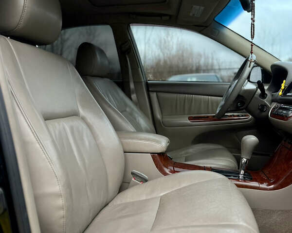 Чорний Тойота Камрі, об'ємом двигуна 3 л та пробігом 203 тис. км за 3999 $, фото 15 на Automoto.ua