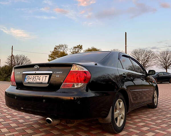 Черный Тойота Камри, объемом двигателя 3 л и пробегом 285 тыс. км за 6500 $, фото 5 на Automoto.ua