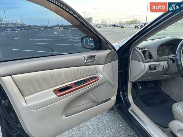 Черный Тойота Камри, объемом двигателя 2.4 л и пробегом 315 тыс. км за 5800 $, фото 12 на Automoto.ua