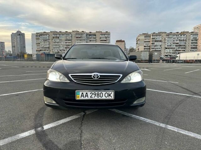 Черный Тойота Камри, объемом двигателя 2.4 л и пробегом 313 тыс. км за 5800 $, фото 1 на Automoto.ua