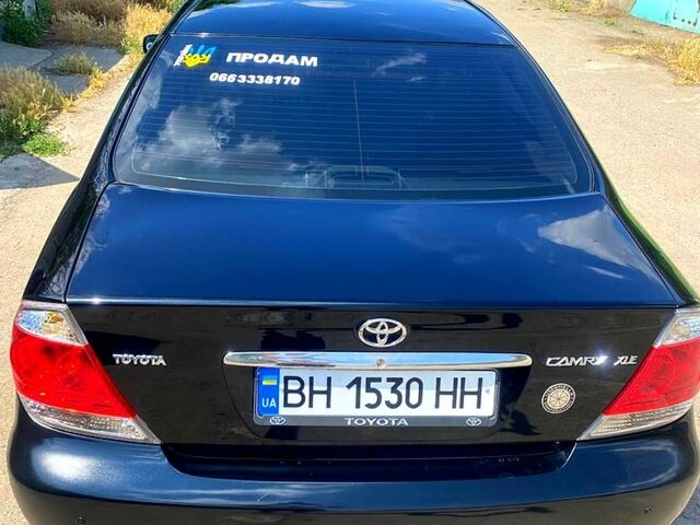 Черный Тойота Камри, объемом двигателя 2.4 л и пробегом 280 тыс. км за 6500 $, фото 1 на Automoto.ua
