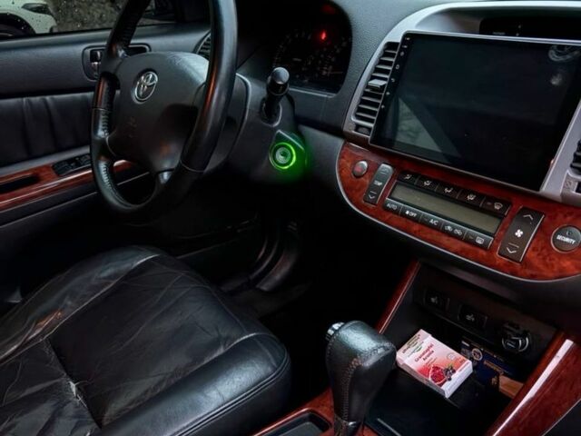 Черный Тойота Камри, объемом двигателя 2.4 л и пробегом 570 тыс. км за 6199 $, фото 6 на Automoto.ua