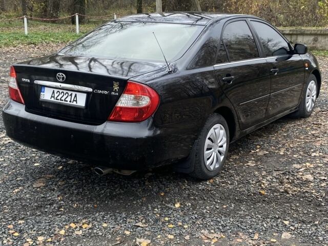 Черный Тойота Камри, объемом двигателя 2.4 л и пробегом 310 тыс. км за 5600 $, фото 5 на Automoto.ua