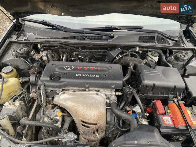 Чорний Тойота Камрі, об'ємом двигуна 2.4 л та пробігом 310 тис. км за 5600 $, фото 7 на Automoto.ua