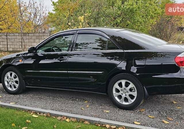 Тойота Камри 2004 в Каменское - Днепродзержинск на Automoto.ua Черный Тойота Камри, объемом двигателя 2 л и пробегом 180 тыс. км за 6700 $, фото 5 на Automoto.ua