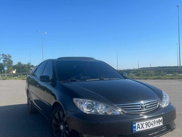 Чорний Тойота Камрі, об'ємом двигуна 2.4 л та пробігом 240 тис. км за 6200 $, фото 11 на Automoto.ua