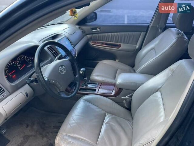 Черный Тойота Камри, объемом двигателя 3 л и пробегом 300 тыс. км за 4400 $, фото 11 на Automoto.ua