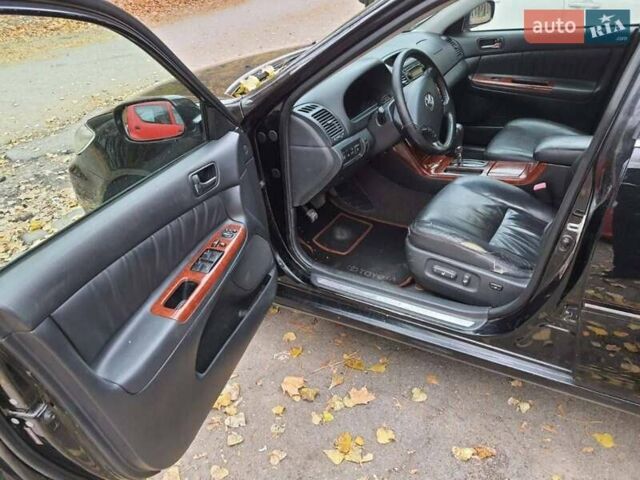 Чорний Тойота Камрі, об'ємом двигуна 3 л та пробігом 218 тис. км за 6400 $, фото 3 на Automoto.ua