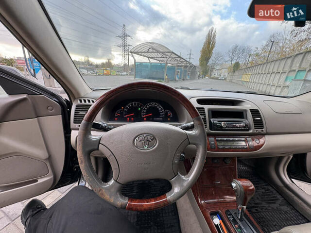 Черный Тойота Камри, объемом двигателя 2.4 л и пробегом 326 тыс. км за 6300 $, фото 18 на Automoto.ua