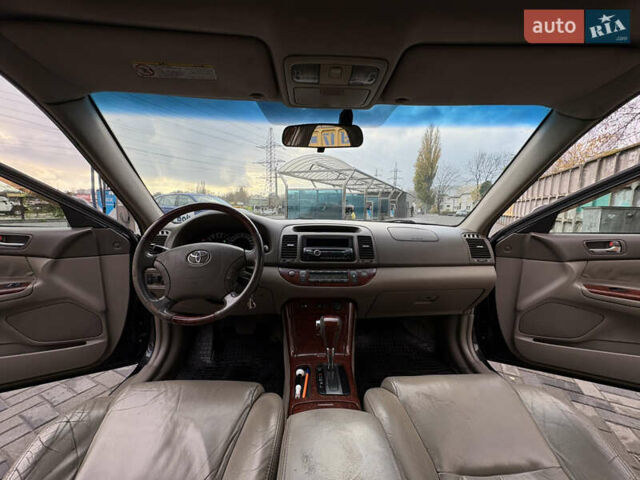 Черный Тойота Камри, объемом двигателя 2.4 л и пробегом 326 тыс. км за 6300 $, фото 22 на Automoto.ua