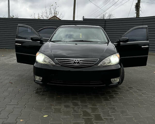 Чорний Тойота Камрі, об'ємом двигуна 2.4 л та пробігом 292 тис. км за 5350 $, фото 9 на Automoto.ua