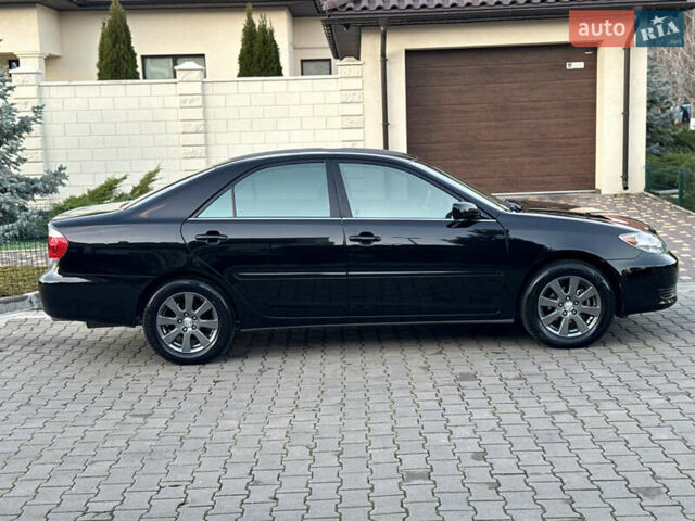 Черный Тойота Камри, объемом двигателя 2.36 л и пробегом 98 тыс. км за 8700 $, фото 24 на Automoto.ua