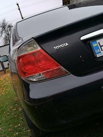 Чорний Тойота Камрі, об'ємом двигуна 2.4 л та пробігом 300 тис. км за 5500 $, фото 1 на Automoto.ua