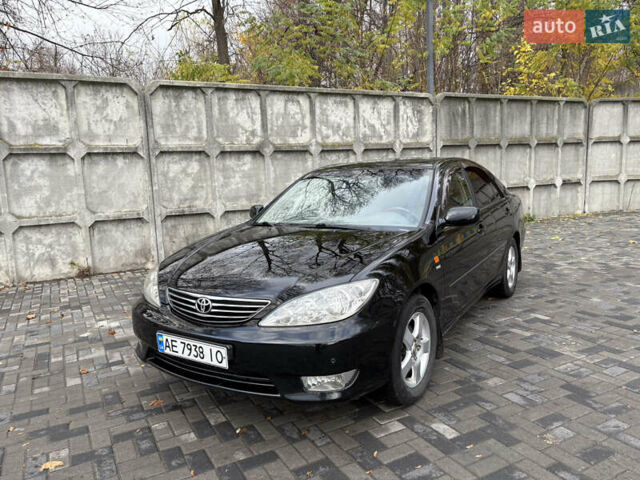 Черный Тойота Камри, объемом двигателя 2.4 л и пробегом 326 тыс. км за 6300 $, фото 1 на Automoto.ua