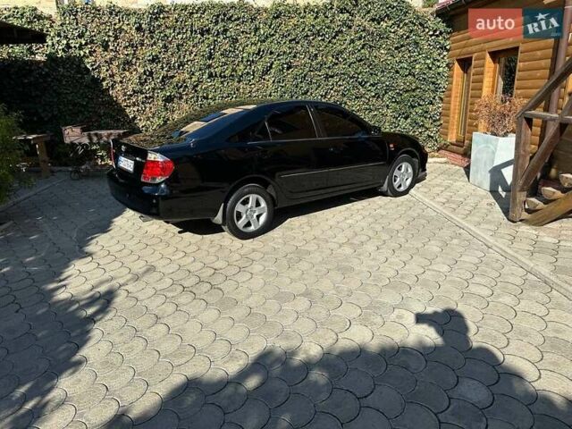 Черный Тойота Камри, объемом двигателя 2.36 л и пробегом 253 тыс. км за 6900 $, фото 9 на Automoto.ua