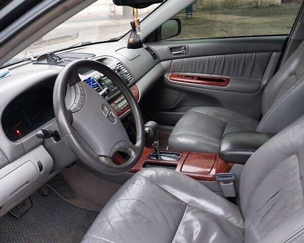 Чорний Тойота Камрі, об'ємом двигуна 3 л та пробігом 267 тис. км за 7500 $, фото 2 на Automoto.ua