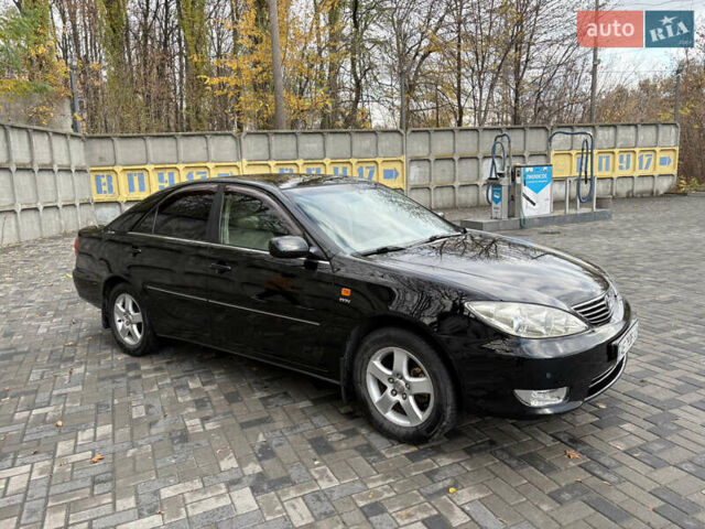 Черный Тойота Камри, объемом двигателя 2.4 л и пробегом 326 тыс. км за 6300 $, фото 8 на Automoto.ua