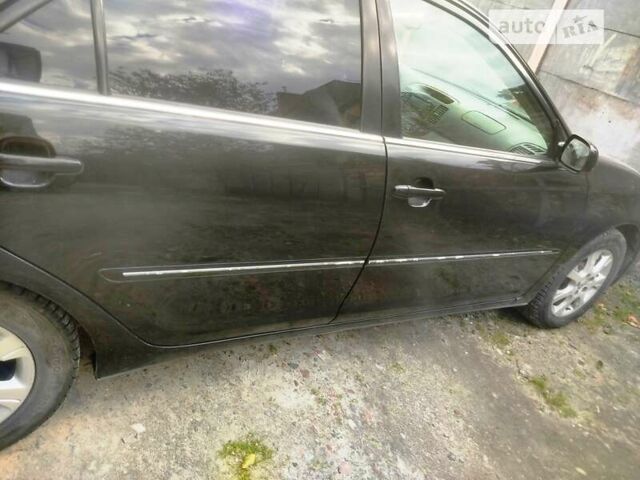 Чорний Тойота Камрі, об'ємом двигуна 3 л та пробігом 208 тис. км за 6700 $, фото 40 на Automoto.ua