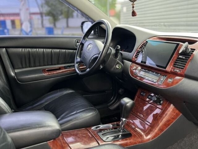 Черный Тойота Камри, объемом двигателя 2.4 л и пробегом 278 тыс. км за 5200 $, фото 7 на Automoto.ua