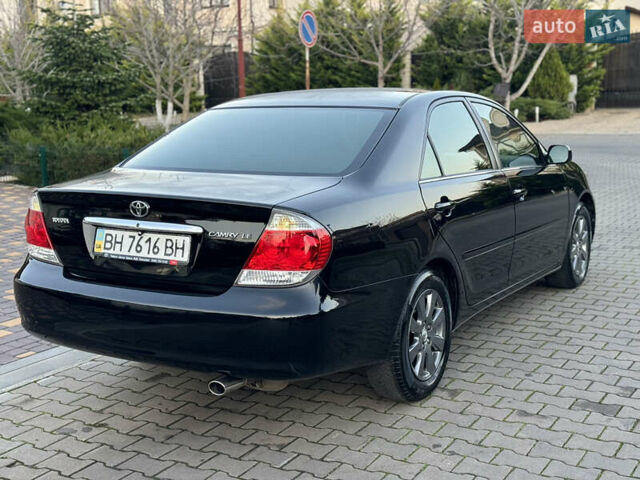 Черный Тойота Камри, объемом двигателя 2.36 л и пробегом 98 тыс. км за 8700 $, фото 22 на Automoto.ua