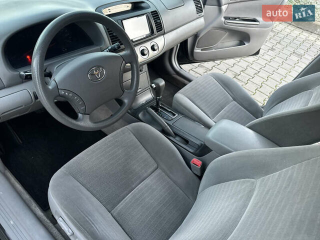 Черный Тойота Камри, объемом двигателя 2.36 л и пробегом 98 тыс. км за 8700 $, фото 58 на Automoto.ua