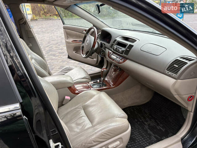 Черный Тойота Камри, объемом двигателя 2.4 л и пробегом 326 тыс. км за 6300 $, фото 15 на Automoto.ua