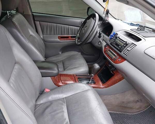 Чорний Тойота Камрі, об'ємом двигуна 3 л та пробігом 267 тис. км за 7500 $, фото 4 на Automoto.ua