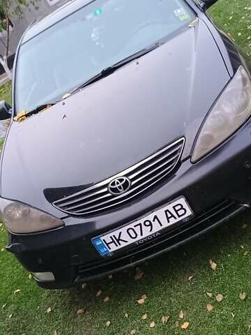 Чорний Тойота Камрі, об'ємом двигуна 2.4 л та пробігом 300 тис. км за 5500 $, фото 16 на Automoto.ua