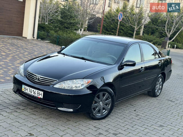 Черный Тойота Камри, объемом двигателя 2.36 л и пробегом 98 тыс. км за 8700 $, фото 1 на Automoto.ua