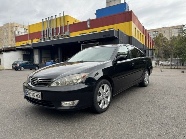 Черный Тойота Камри, объемом двигателя 2.4 л и пробегом 180 тыс. км за 6000 $, фото 1 на Automoto.ua