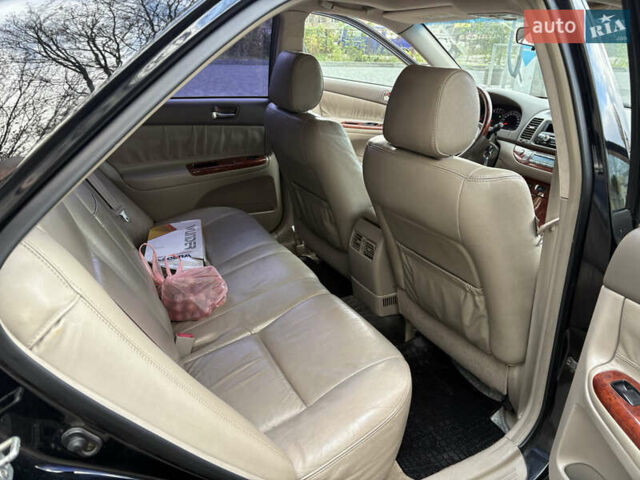 Черный Тойота Камри, объемом двигателя 2.4 л и пробегом 326 тыс. км за 6300 $, фото 17 на Automoto.ua