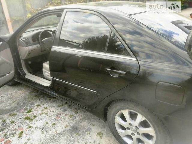 Чорний Тойота Камрі, об'ємом двигуна 3 л та пробігом 208 тис. км за 6700 $, фото 30 на Automoto.ua