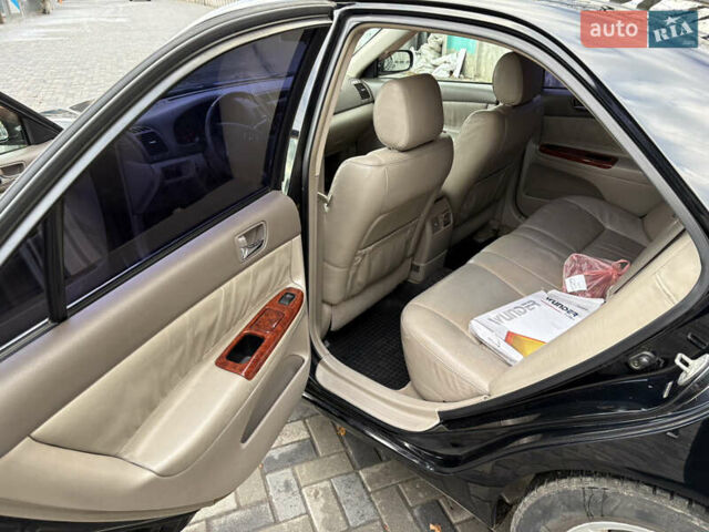 Черный Тойота Камри, объемом двигателя 2.4 л и пробегом 326 тыс. км за 6300 $, фото 11 на Automoto.ua