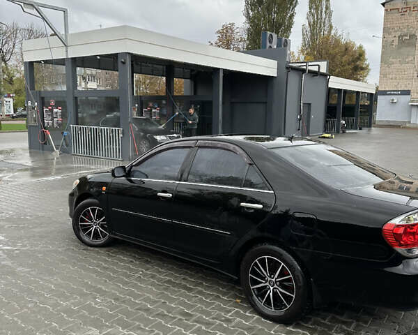 Чорний Тойота Камрі, об'ємом двигуна 2.4 л та пробігом 292 тис. км за 5350 $, фото 4 на Automoto.ua