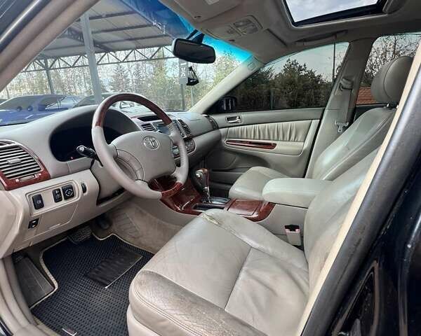Черный Тойота Камри, объемом двигателя 2.36 л и пробегом 167 тыс. км за 7900 $, фото 2 на Automoto.ua