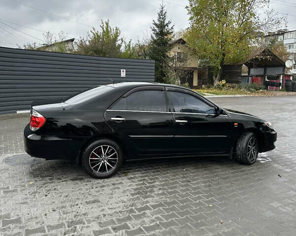 Чорний Тойота Камрі, об'ємом двигуна 2.4 л та пробігом 292 тис. км за 5350 $, фото 7 на Automoto.ua