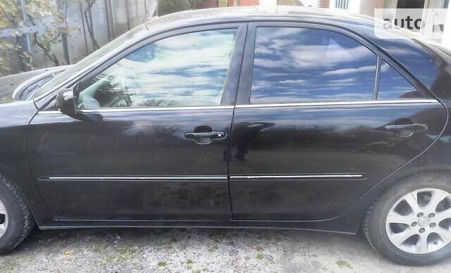 Чорний Тойота Камрі, об'ємом двигуна 3 л та пробігом 208 тис. км за 6700 $, фото 32 на Automoto.ua