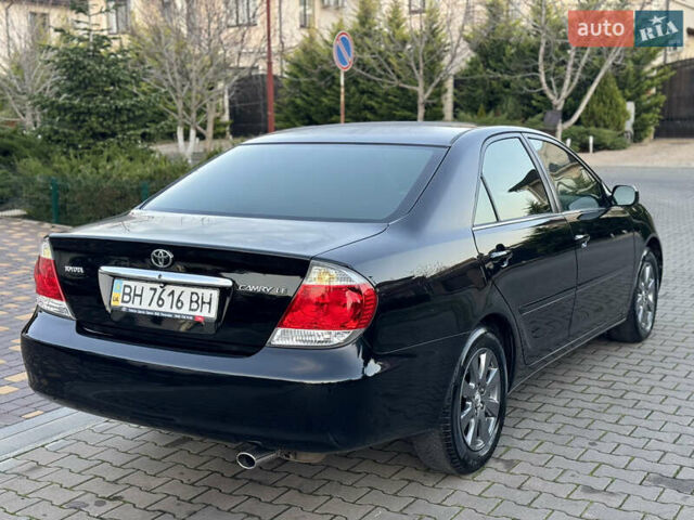 Черный Тойота Камри, объемом двигателя 2.36 л и пробегом 98 тыс. км за 8700 $, фото 21 на Automoto.ua